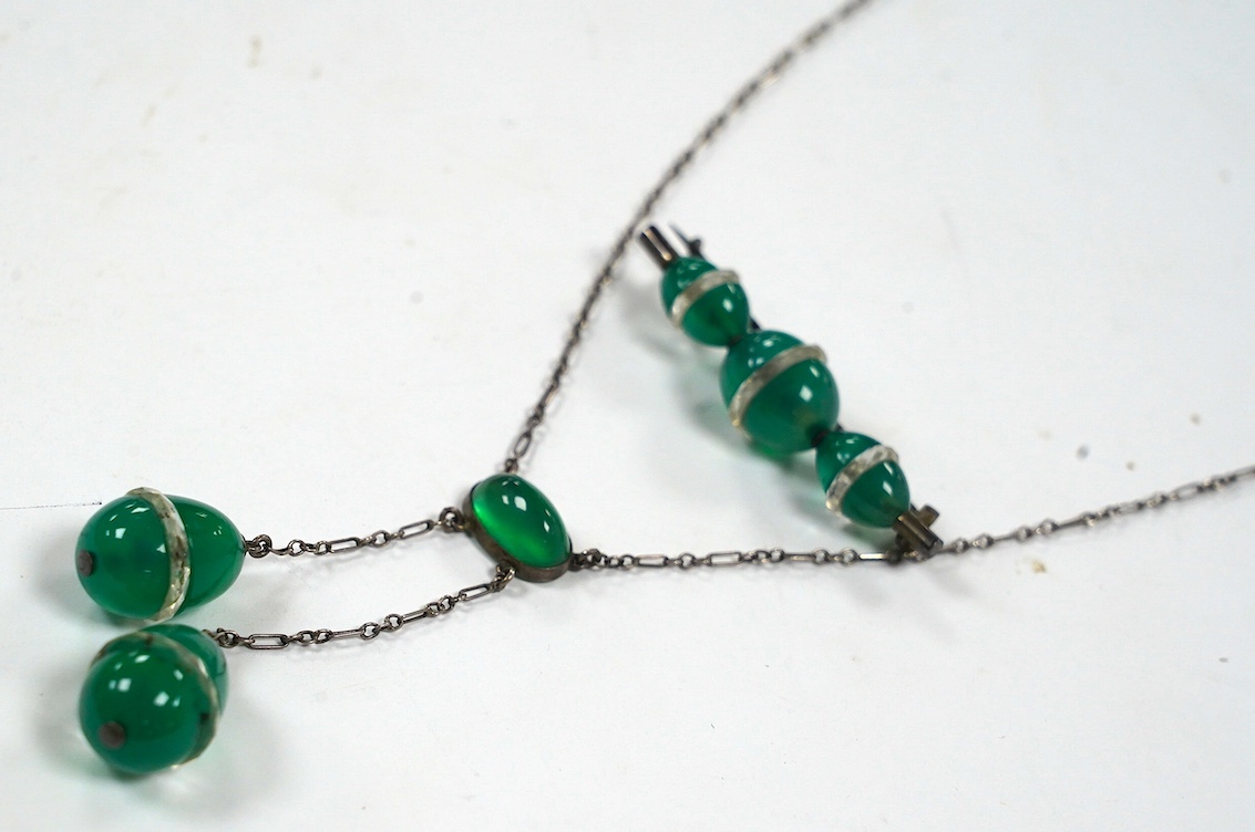 A white metal and green paste set double drop pendant necklace, 54cm and a similar brooch. Condition - fair to good